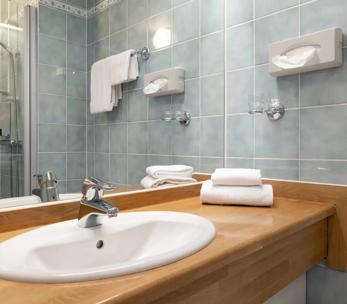 Bathroom with sink, shower and mirror